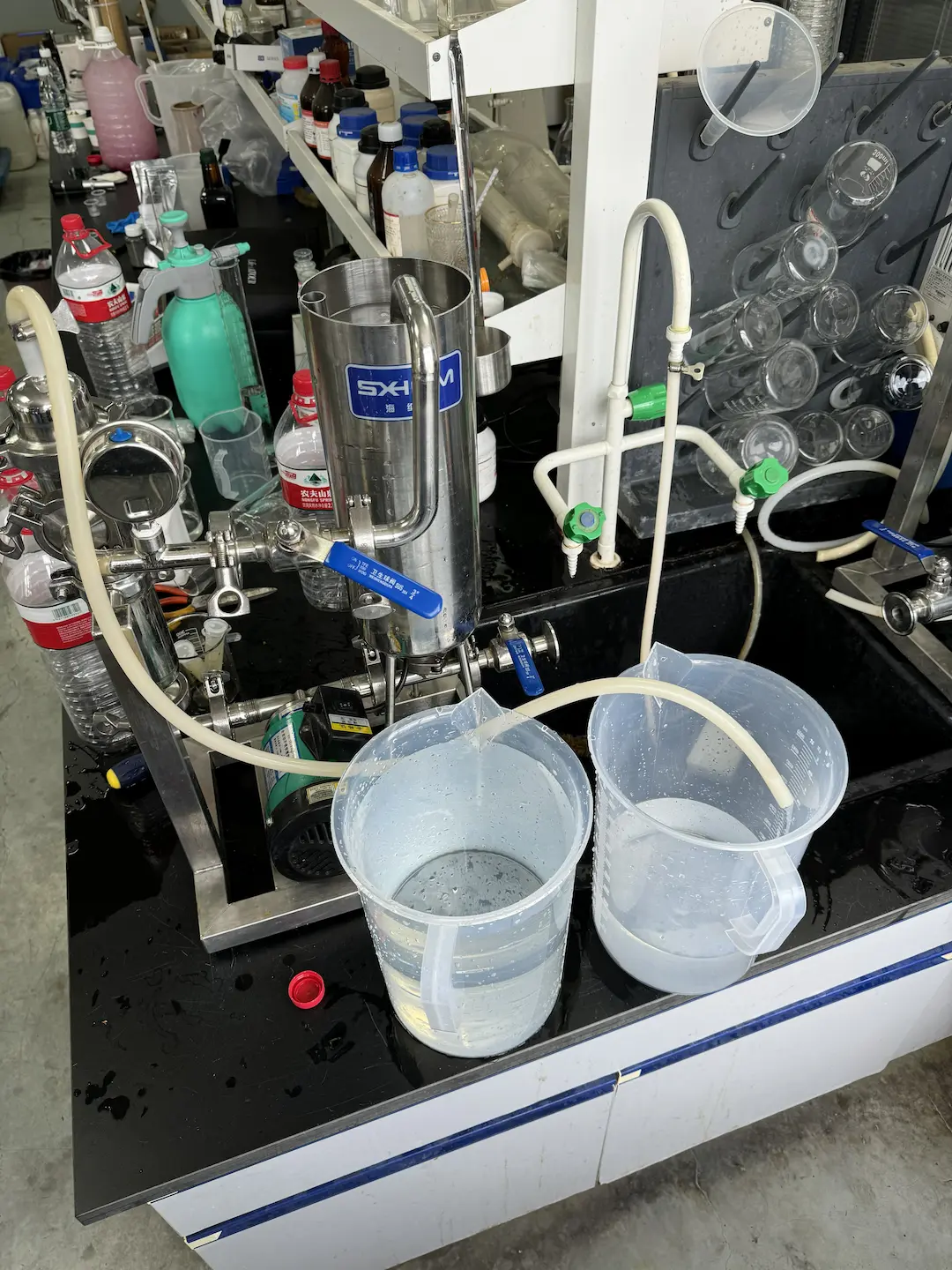 Industrial processing equipment with tubes, containers and machinery in a Chinese factory