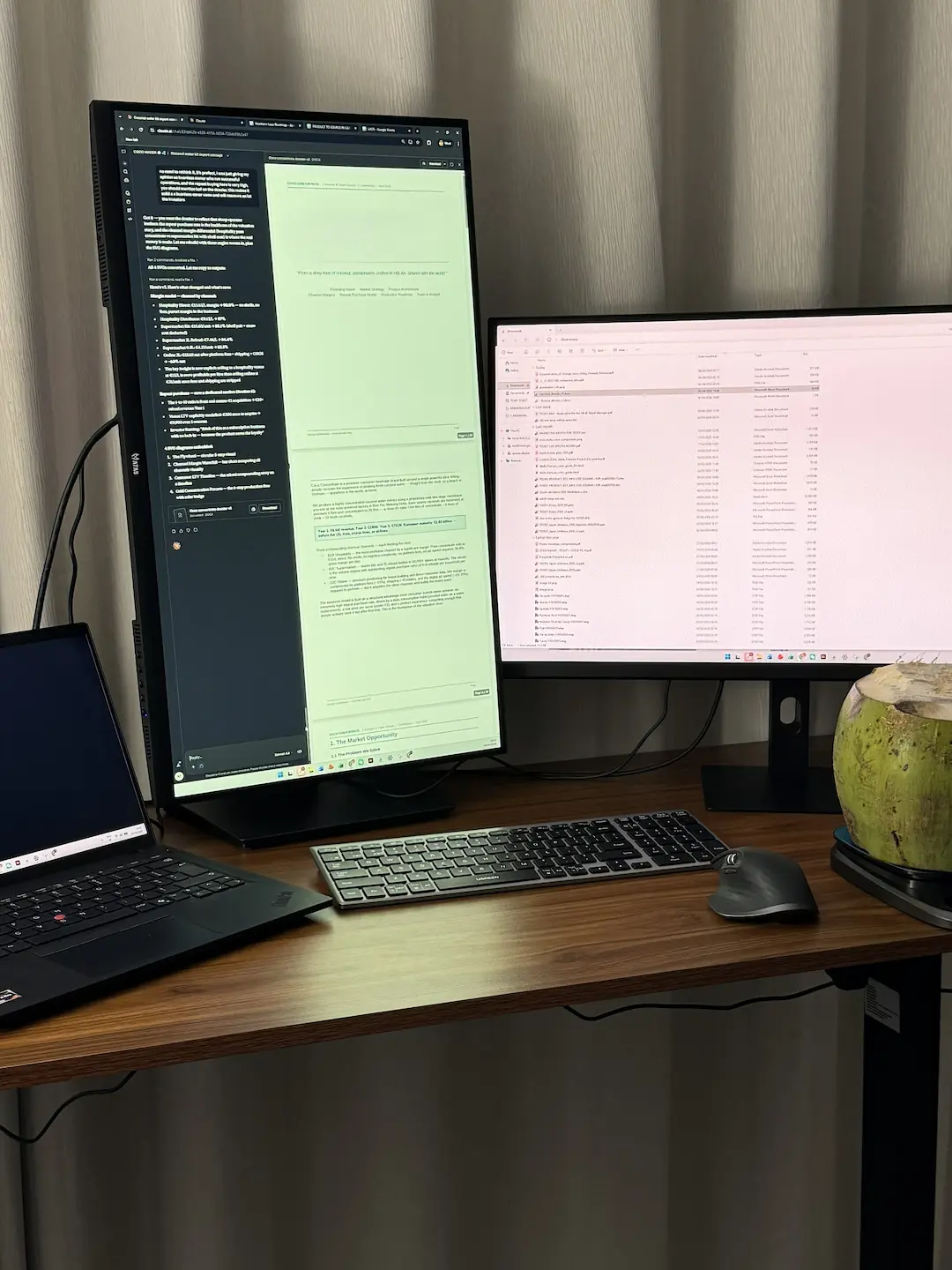 Gaëtan at his desk with two monitors and a coconut water, the daily work ritual